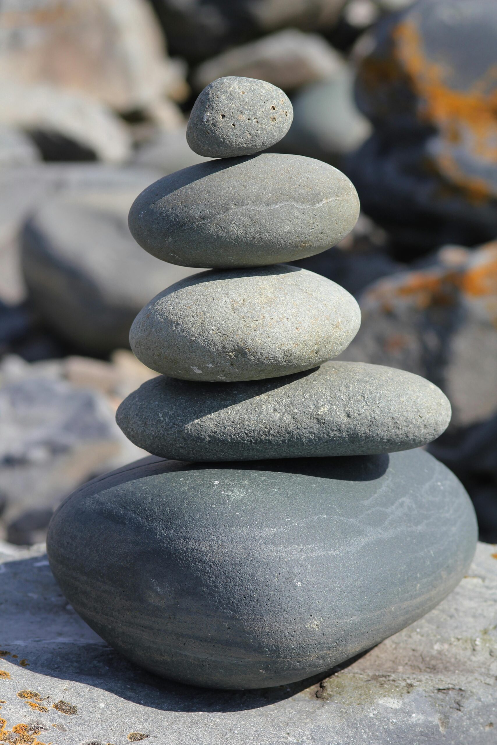 Stacked stones create a harmonious balance, exemplifying simplicity and tranquility in nature.